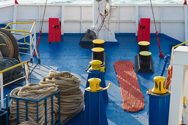 blue ferry deck with winch and hawsers