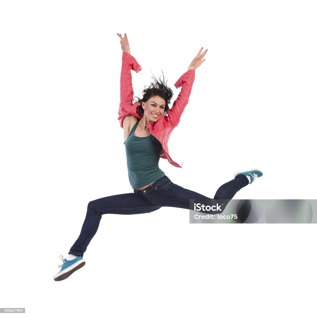 Celebrating woman jumping Smiling woman jumping with arm raised. Full length studio shot isolated on white. 30-39 Years Stock Photo