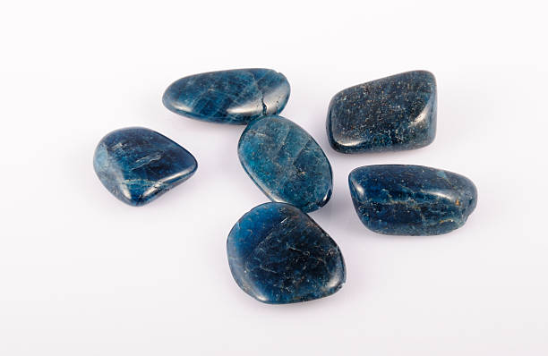 istock deep blue Apatite gemstone on white. photo toned 492678072