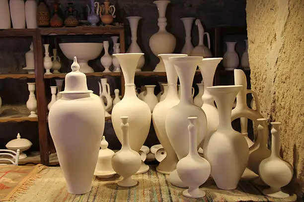 Display of handmade pottery collection in Cappadocia, Turkey.