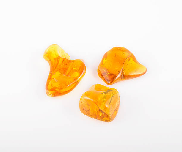 istock amber gemstone on white. Soft focus, photo toned 492678216