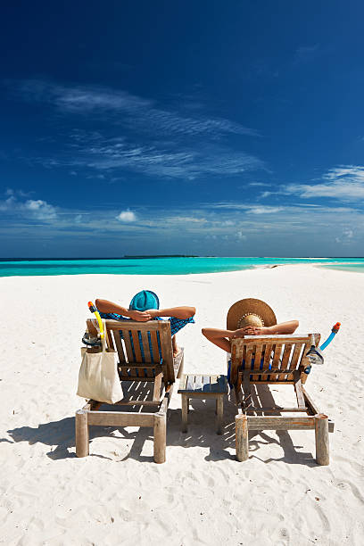 istock Couple relax on a beach at Maldives 492680067