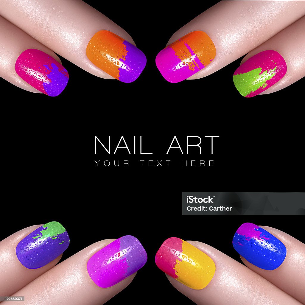 Colorful Fluor Nail Polish. Art Nail Fingers with colorful nail polish and drops of water. Manicure and makeup concept. Closeup image isolated on black with sample text Fingernail Stock Photo