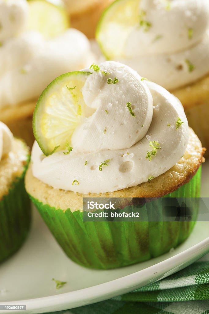 Homemade Margarita Cupcakes with Frosting Homemade Margarita Cupcakes with Frosting and Limes Alcohol - Drink Stock Photo