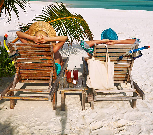 istock Couple in green on a beach at Maldives 492680881