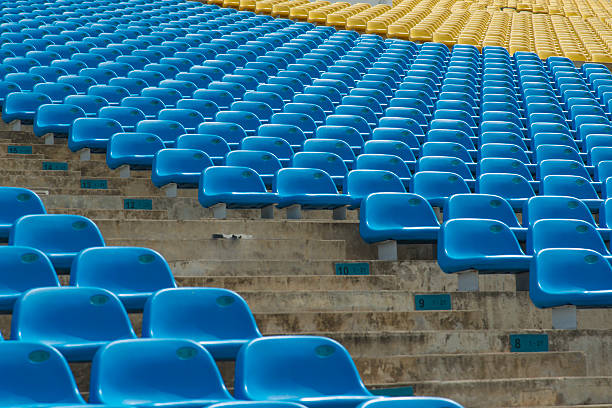 Field of empty blue plastic stadium seats. A field of empty blue plastic stadium seats. paralympic games stock pictures, royalty-free photos & images