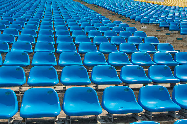 istock Field of empty blue plastic stadium seats. 492681301
