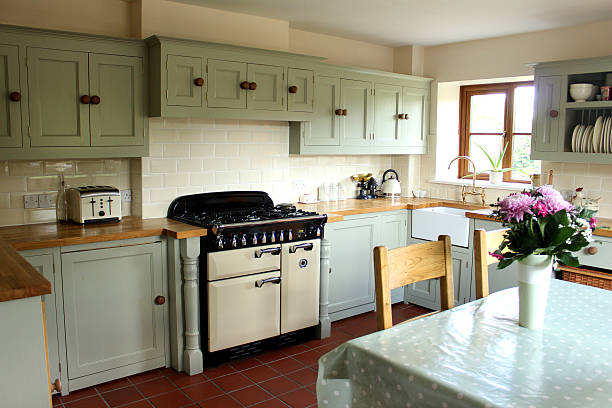 istock Traditional country kitchen, gas range cooker, wooden worktops, table, chairs 492681661