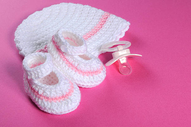 istock Baby girl pink and white stripe wool booties, bonnet 492682093