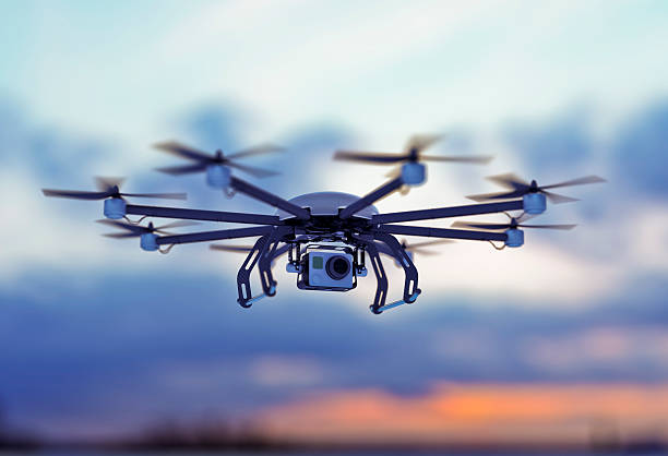 drone white cloudy dusk sky a drone flying in a cloudy sky where the sun goes down helicopter photos stock pictures, royalty-free photos & images