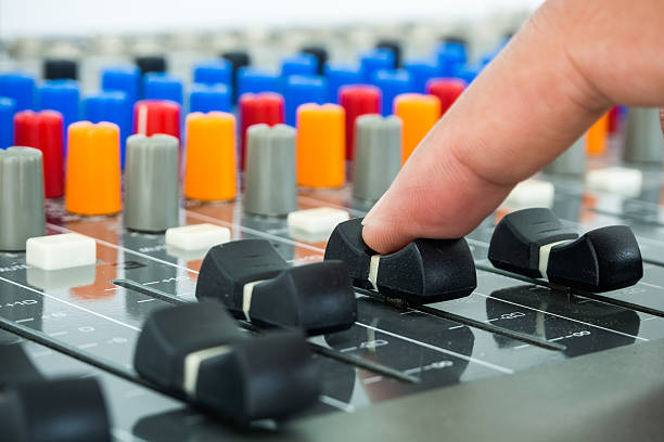 istock Hand making slide on an audio soundboard 492685403