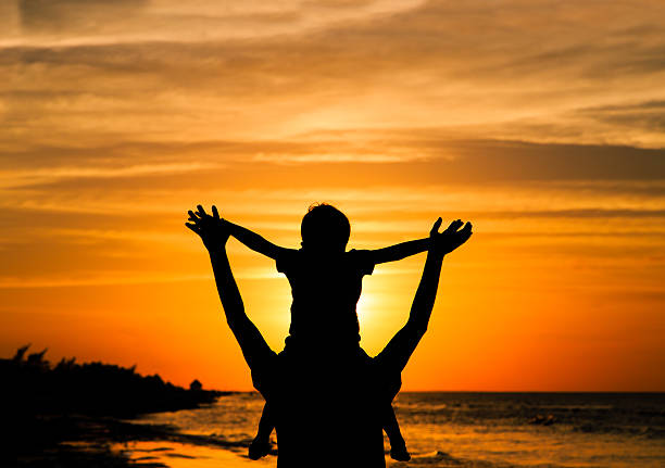 istock father and son having fun at sunset 492692752