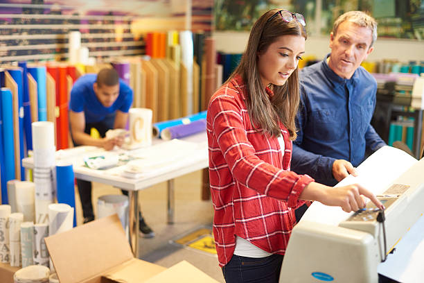 istock woman working at a digital printers 492693602