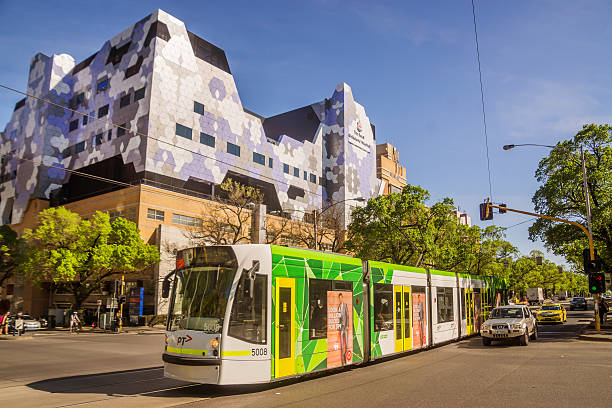 Royal Melbourne Hospital Melbourne, Australia - October 15, 2015: Tram 19 goes past the Royal Melbourne Hospital on Royal Parade.  image created 21st century blue architecture wide angle lens stock pictures, royalty-free photos & images