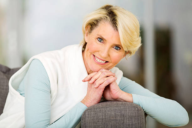 istock middle aged woman relaxing at home 492698010