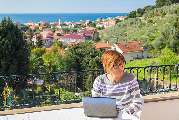 istock Woman working with netbook outdoors 492698168
