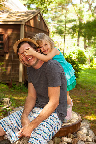 istock Father and daughter playing in their backyard. 492698206