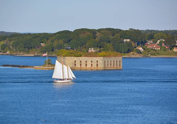 Portland Maine, Fort Gorges view of a Tall ship circling Fort Gorges on Hog Island Ledge in the Casco Bay at the entrance to the harbor at Portland, Maine  casco bay stock pictures, royalty-free photos & images