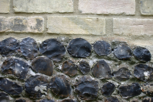 White bricks and knapped flint wall. Could be used as a background.