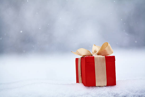 istock gift box in the snow outdoors 492701466