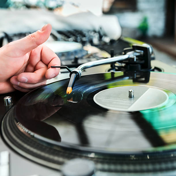 istock Dj mixes the track in club 492703082