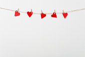 Red hearts hanging on clothesline