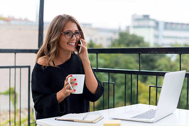 istock Smiling Young woman talking on mobile phone 492703948
