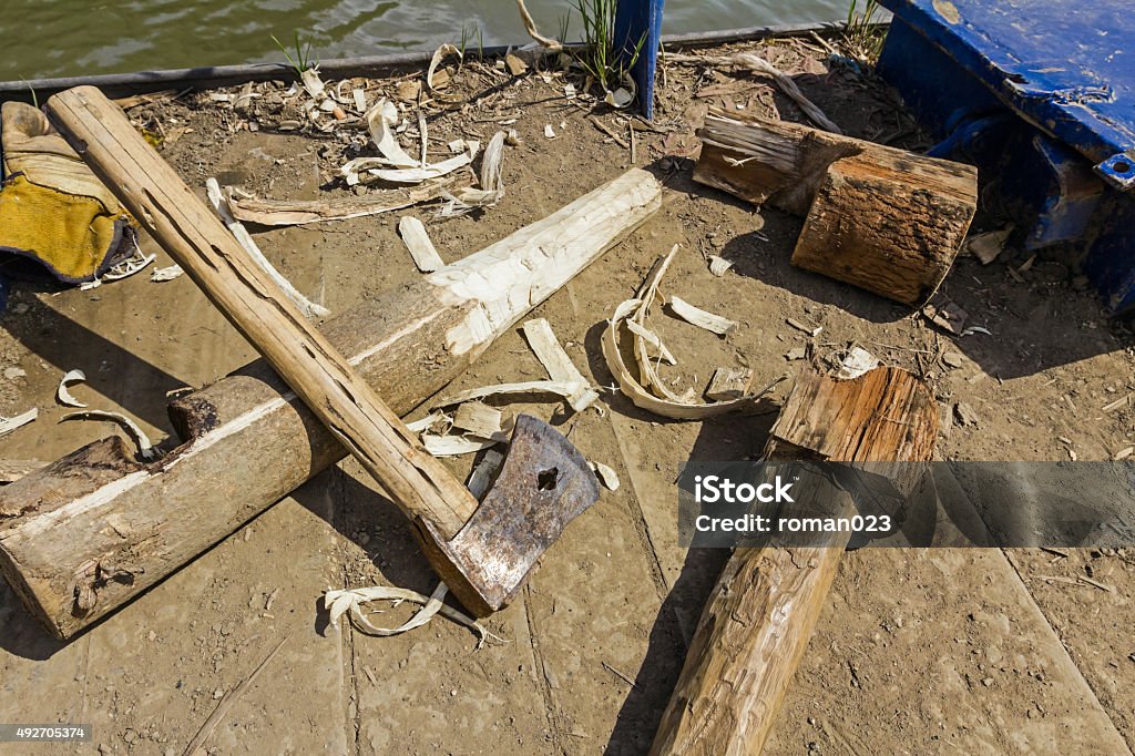 Carpentry skill with ax as main tool. Making new tool for manually pulling ferry boat from wood. 2015 Stock Photo