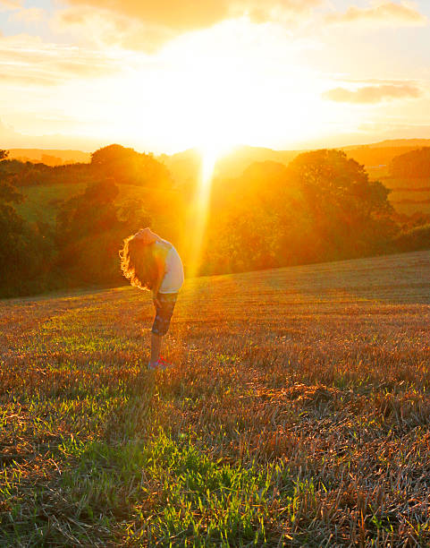 istock Autumn sunset and girl stretching 492706020