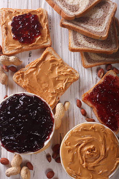 istock Toast with peanut butter and jam closeup. vertical top view 492708182