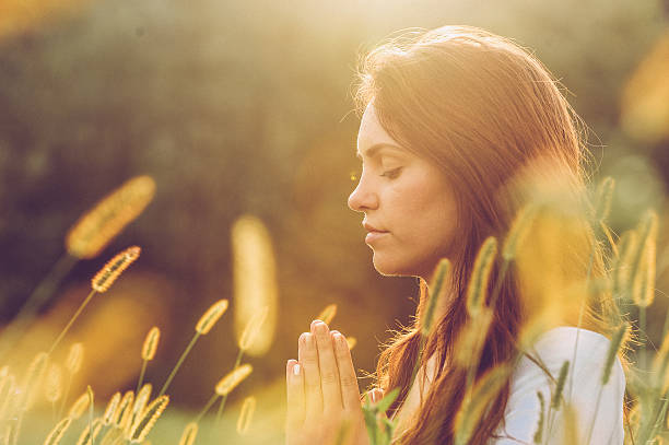 Young Woman Practicing Yoga Outdoors
