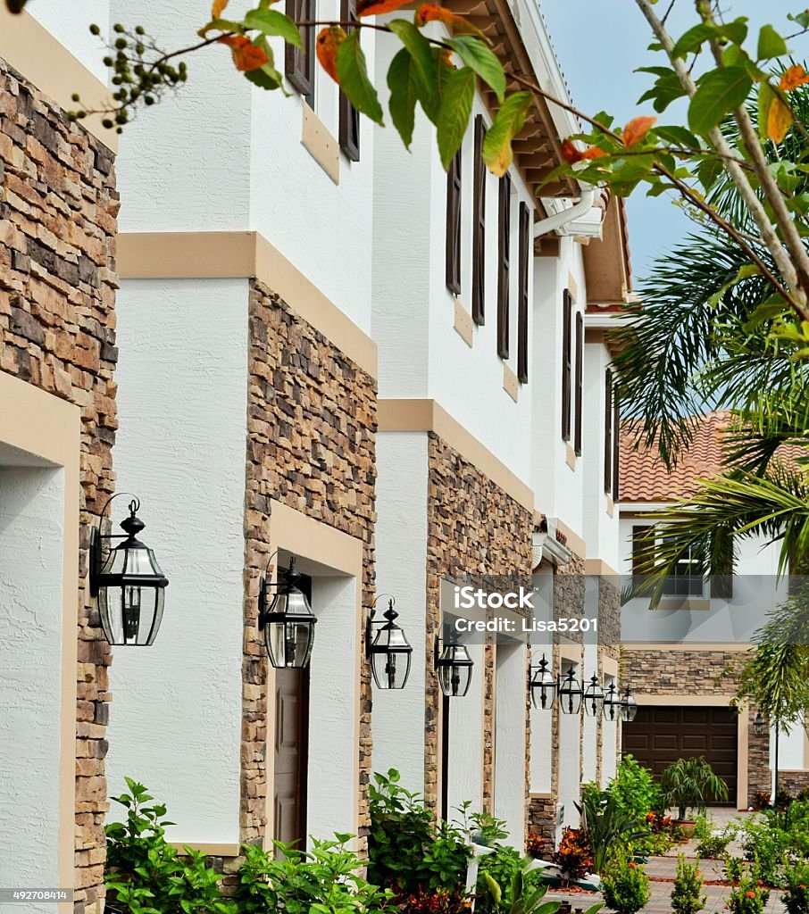 Townhouses A row of identical new construction townhomes in south Florida Gated Community Stock Photo