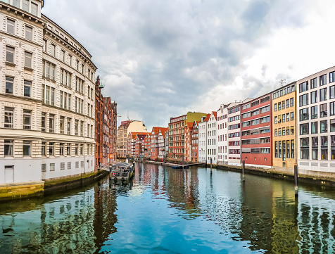Beautiful view of colorful buildings and Nikolaifleet from famous Holzbrucke (so-called wooden bridge) in the Altstadt quarter of Hamburg, Germany