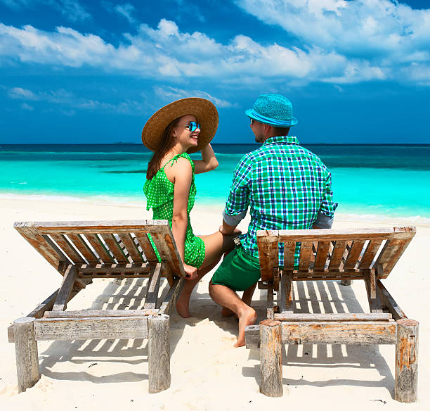 istock Couple in green on a beach at Maldives 492727949