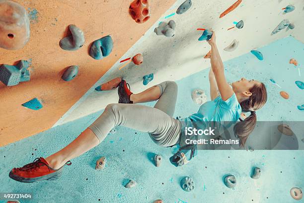 Young Woman Training In Climbing Gym Stock Photo - Download Image Now - Bouldering, Climbing, Indoors