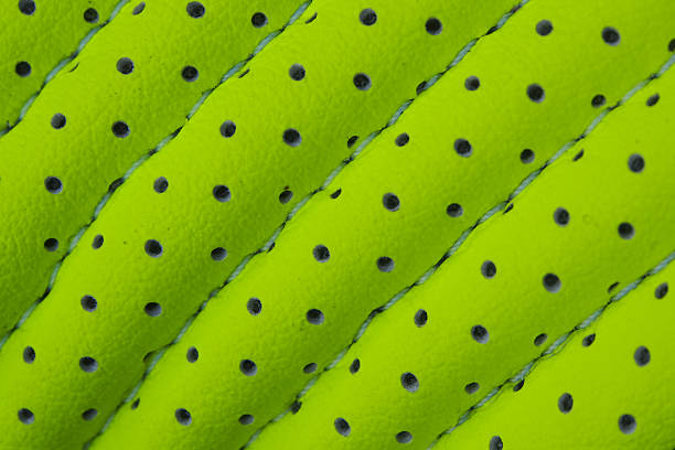 istock Texture of green leather with holes 492731465