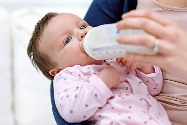 istock Mother feeding baby 492731715