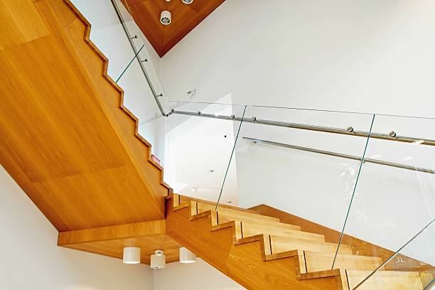 istock Modern interior with wooden stairs 492732036