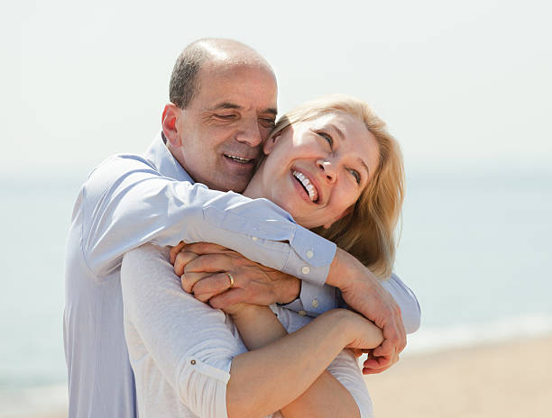 istock Elderly couple at sea shore 492732043