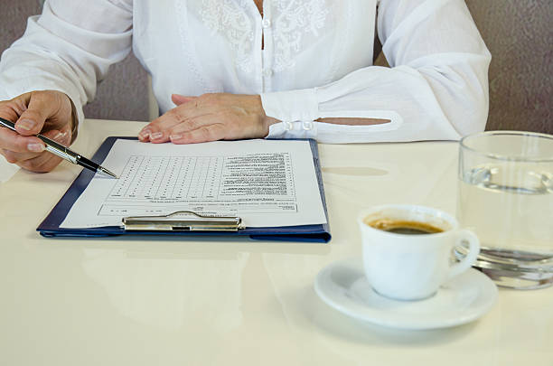 istock businesswoman over paperwork 492732598