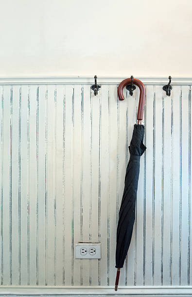istock umbrella hanging on the wall 492732950
