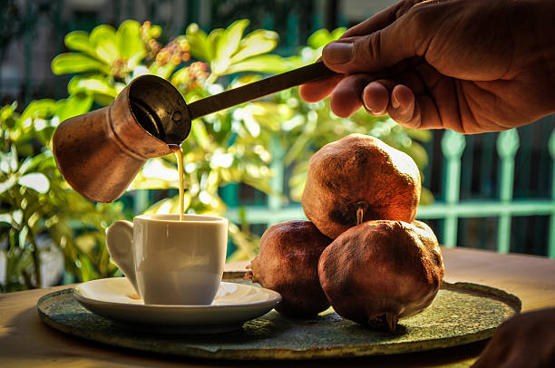 istock greek coffee and pomegranate in atmospheric light 492734348