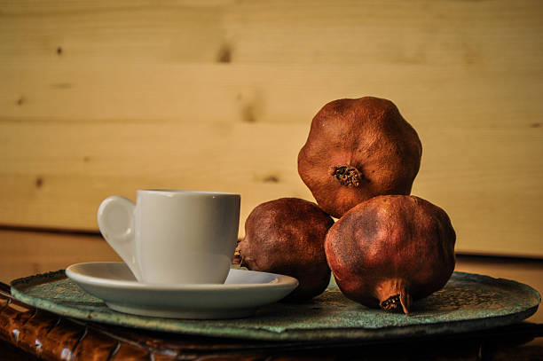 greek coffee and pomegranate in atmospheric light