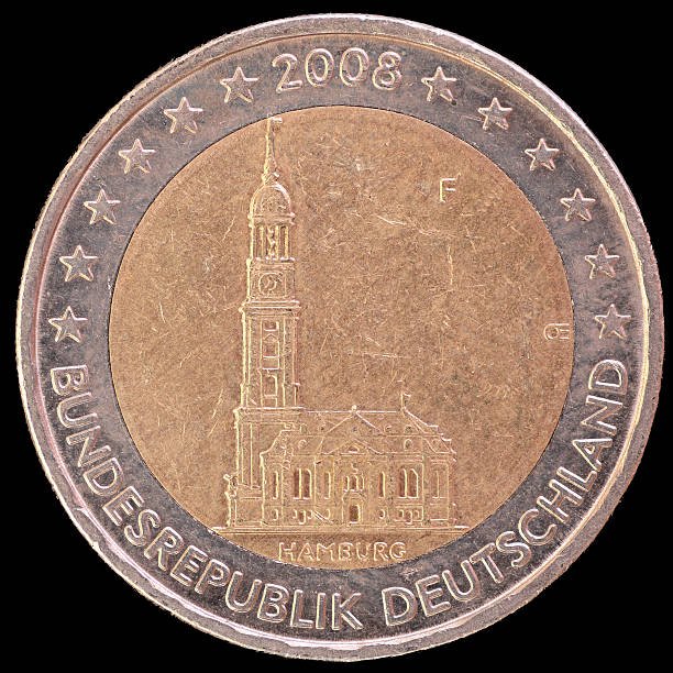 A commemorative circulated two euro coin issued by Germany in 2008 depicting the baroque church of St. Michaelis located in the federal state of Hamburg. Image isolated on black background.