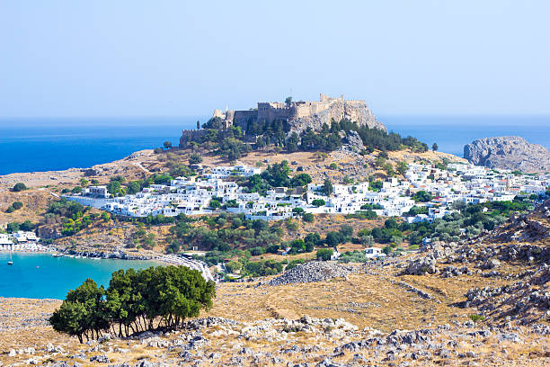 istock town in the mountains. Lindos, Greece 492736412