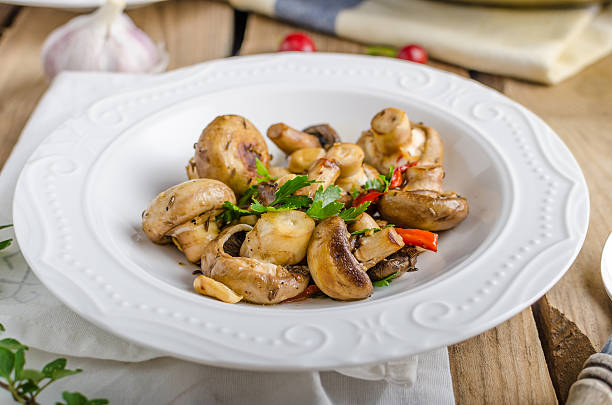 istock Fresh mushroom salad with chilli and herbs 492736434