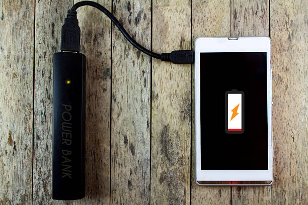 istock smart phone is charging with power bank 492739730