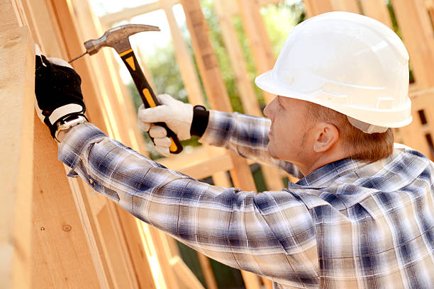 istock construction worker on a background of a frame house 492739838