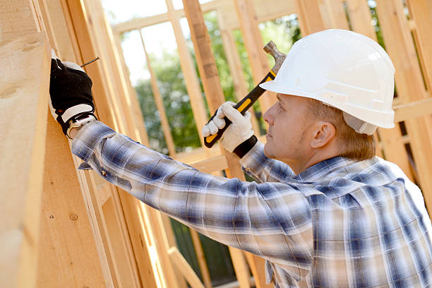 istock construction worker on a background of a frame house 492739884