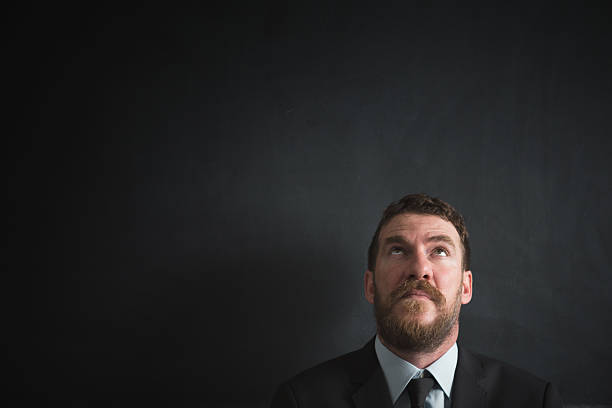 istock Businessman on black background 492740380